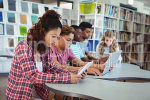 Students using laptop, digital tablet