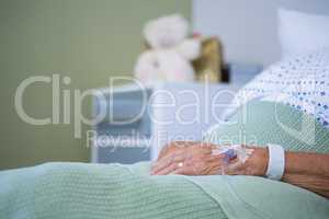 Saline on senior patients hand
