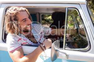 Man looking out of camper van window