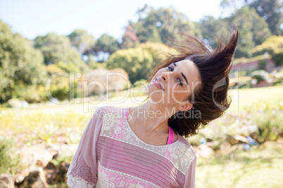Woman swaying her hair in park