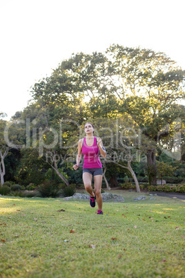 Female jogger listening to music while jogging