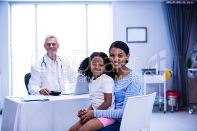 Portrait of smiling doctor and patient