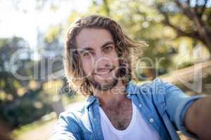 Portrait of man standing in park