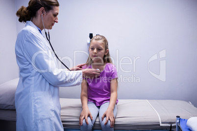 Doctor examining a patient with stethoscope