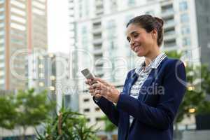 Business executive using mobile phone