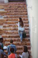 Students moving up staircase