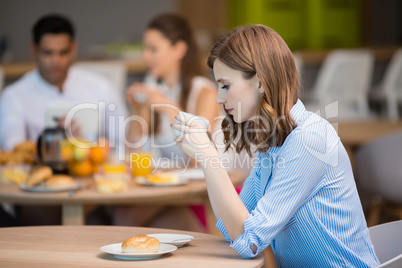 Businesswoman drinking cup of coffee