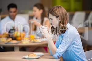 Businesswoman drinking cup of coffee