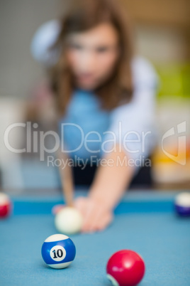 Business executive playing pool