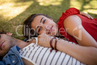 Couple embracing in park