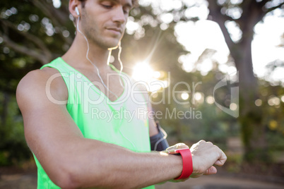 Man checking time while jogging