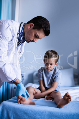 Male doctor examining patient