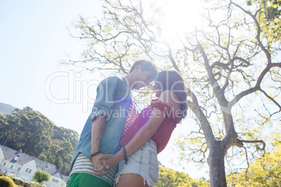Couple holding hands in park