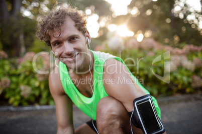 Happy man listening to music on mobile phone