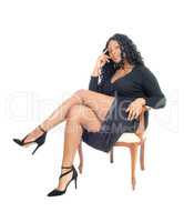 African woman sitting on chair.