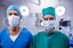 Portrait of surgeons wearing surgical mask in operation theater