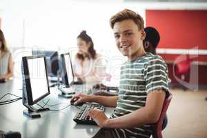 Student using computer in classroom