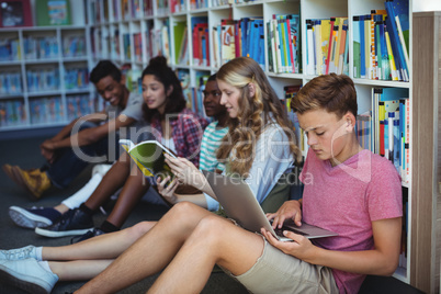 Attentive students studying in library