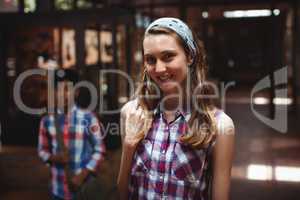 Portrait of classmate standing in corridor