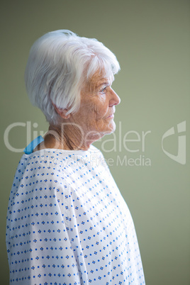 Senior patient standing at hospital