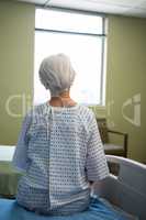 Thoughtful senior patient sitting at hospital