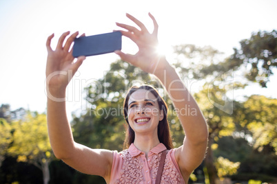 Beautiful woman taking a selfie