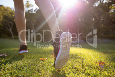 Feet of jogger jogging in the park