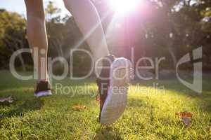 Feet of jogger jogging in the park