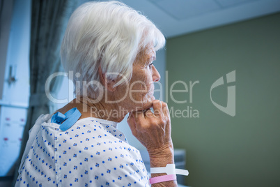 Senior patient standing at hospital