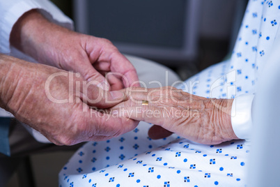 Doctor examining senior patient