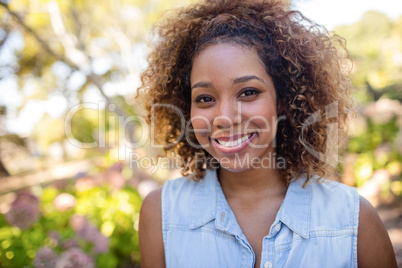 Portrait of woman standing in park