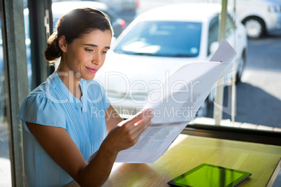 Female executive looking at documents