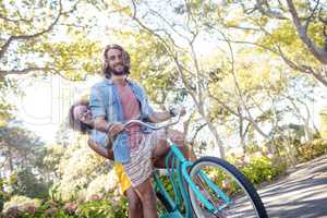 Portrait of couple cycling in the park