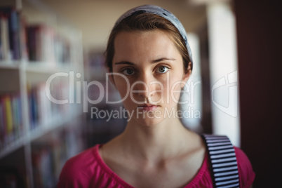 Portrait of schoolgirl in library