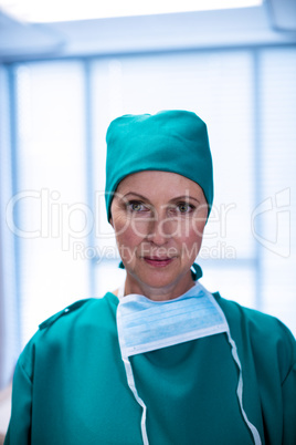 Portrait of female surgeon standing in operation theater