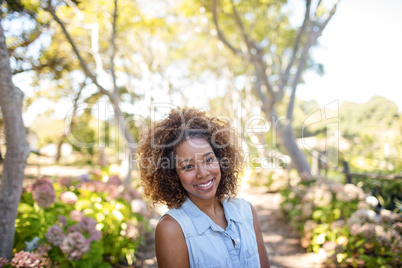 Portrait of woman standing in park