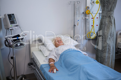 Senior patient lying on bed