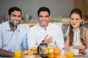 Portrait of smiling business colleagues having breakfast together
