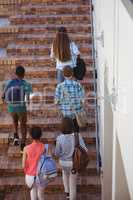 Students moving up staircase