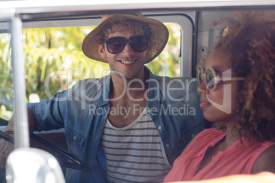 Couple sitting in campervan