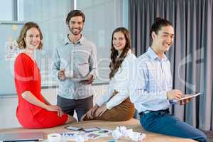 Smiling business executives in conference room