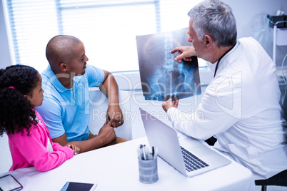 Doctor discussing x-ray report with patient