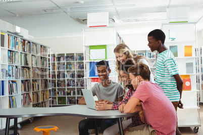 Group of students using laptop