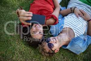 Couple clicking a selfie in park