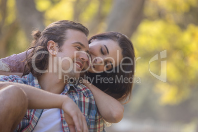 Young couple smiling in park