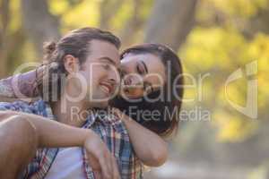 Young couple smiling in park