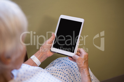 Senior patient holding digital tablet