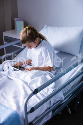 Patient using digital tablet in ward