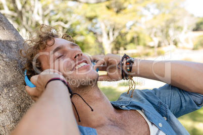 Man listening to music in park