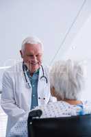 Doctor interacting with senior patient
